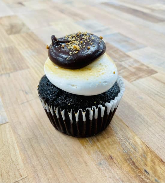 One S'more Cupcake on a wooden countertop