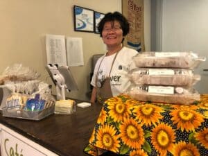 Student smiling at Cafe register