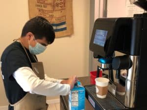 Student Making Espresso Beverage at the Cafe
