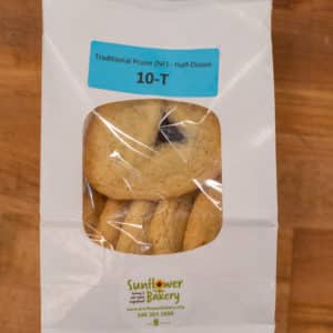 Window bag labeled "Traditional Prune (NF) - Half-Dozen 10-T" with traditional prune hamantaschen visible through the window.