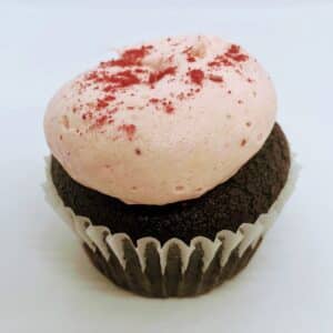 Single Chocolate Strawberry Cupcake, chocolate cake with light pink frosting and freeze dried strawberry powder decoration.