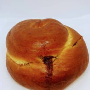 Cinnamon Swirl Round Challah on a white background.