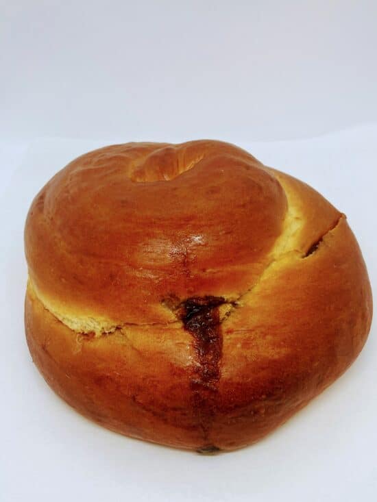 Cinnamon Swirl Round Challah on a white background.