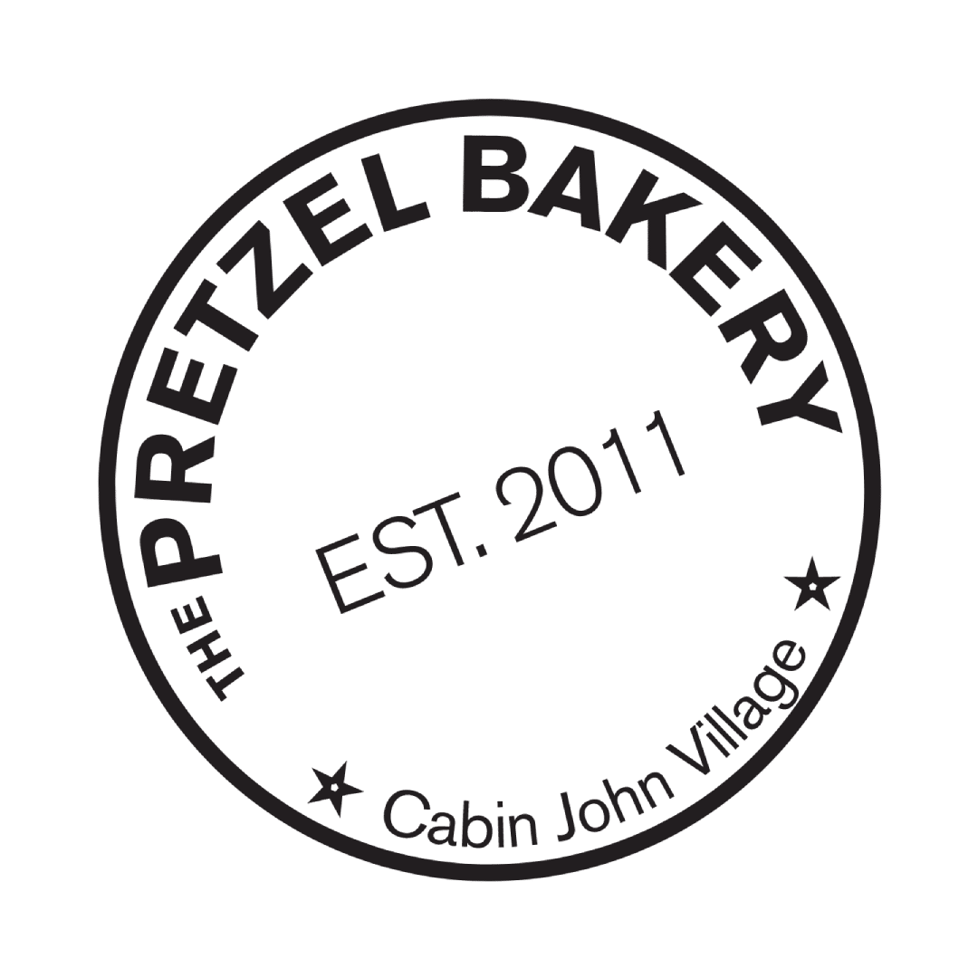 Circular logo of The Pretzel Bakery at Cabin John Village. Established in 2011.