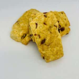 3 cranberry scones on a white background
