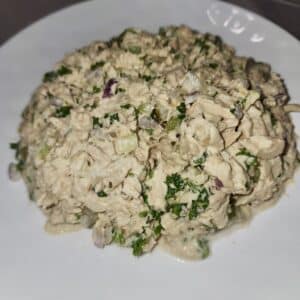 Tuna salad on a white plate.