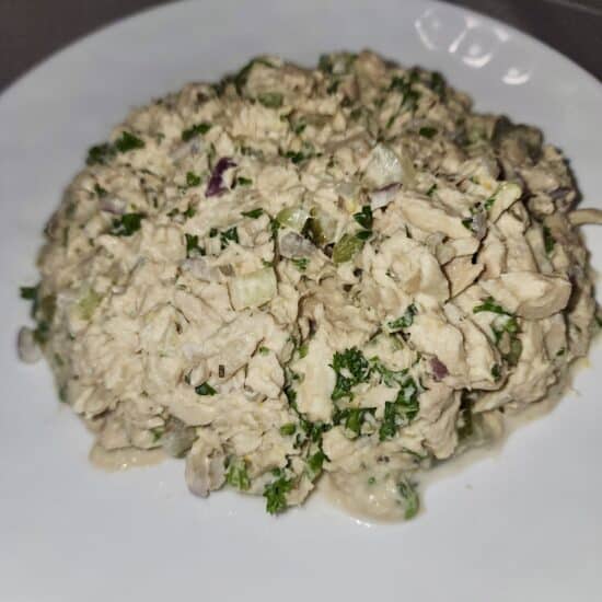 Tuna salad on a white plate.